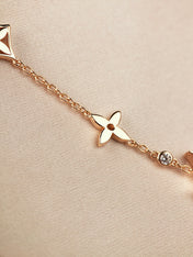 STAR AND SUN 7 MOTIFS GOLD BRACELET