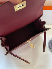 KELLY MINI 20 BAG IN GARNET RED CALFSKIN WITH GOLD HARDWARE