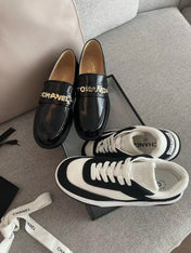 MOCCASINS IN BLACK CALFSKIN GOLD METAL LOGO