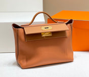 HM 26S 24/24 29MM IN ORANGE EVERCOLOR CALFSKIN GOLD KELLY BUCKLE
