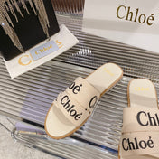 WOODY SLIPPER IN BEIGE MIX BLACK CANVAS
