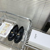 MARGARET CHUNKY LOAFER WITH FRINGES AND TRIOMPHE CHAIN IN POLISHED BULL GLOSSY BLACK