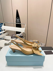 SLINGBACK KITTEN HEEL IN TORTILLA BROWN SHINY CALFSKIN ATTACHED FLOWERS