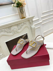 THONG SANDALS IN THISTLE PURPLE CALFSKIN WITH GOLD LOGO
