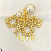 CD 26S CRYSTAL CD CHARM PEARL DROP EARRINGS IN GOLD METAL 633101