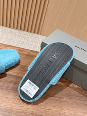 FURRY SLIDES IN SKY BLUE CURLY SHEARLING