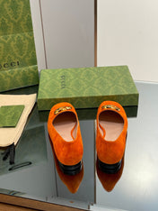 BLONDIE LOGO-PLAQUE LOAFERS IN TIGER ORANGE SUEDE WITH GOLD HARDWARE