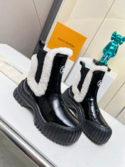 LV RUBY FLAT ANKLE BOOT IN BLACK CALFSKIN AND WHITE SHEARLING