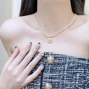CD 26S CD LOGO PEARL BEADED PENDANT NECKLACE IN GOLD METAL