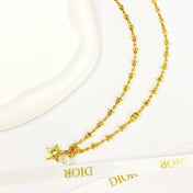 CD 26S STAR CHAIN PEARL PENDANT NECKLACE IN GOLD TONE METAL 631051