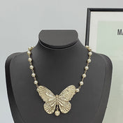 CD 26S PEARL STRAND BUTTERFLY PENDANT NECKLACE IN GOLD METAL 633112
