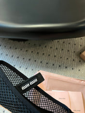 MIUMIU 26S BALLERINAS IN BLACK MESH FABRIC WITH BOW
