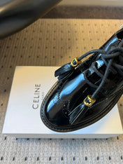 CELINE 26S SAINTNJORD TASSEL LOAFER 50 MM IN BLACK CALFSKIN
