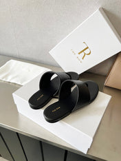 THE ROW 26S FLAT THONG SANDALS IN BLACK CALFSKIN