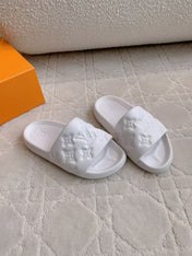 LV EMBOSSED POOL PILLOW SANDALS IN WHITE RUBBER