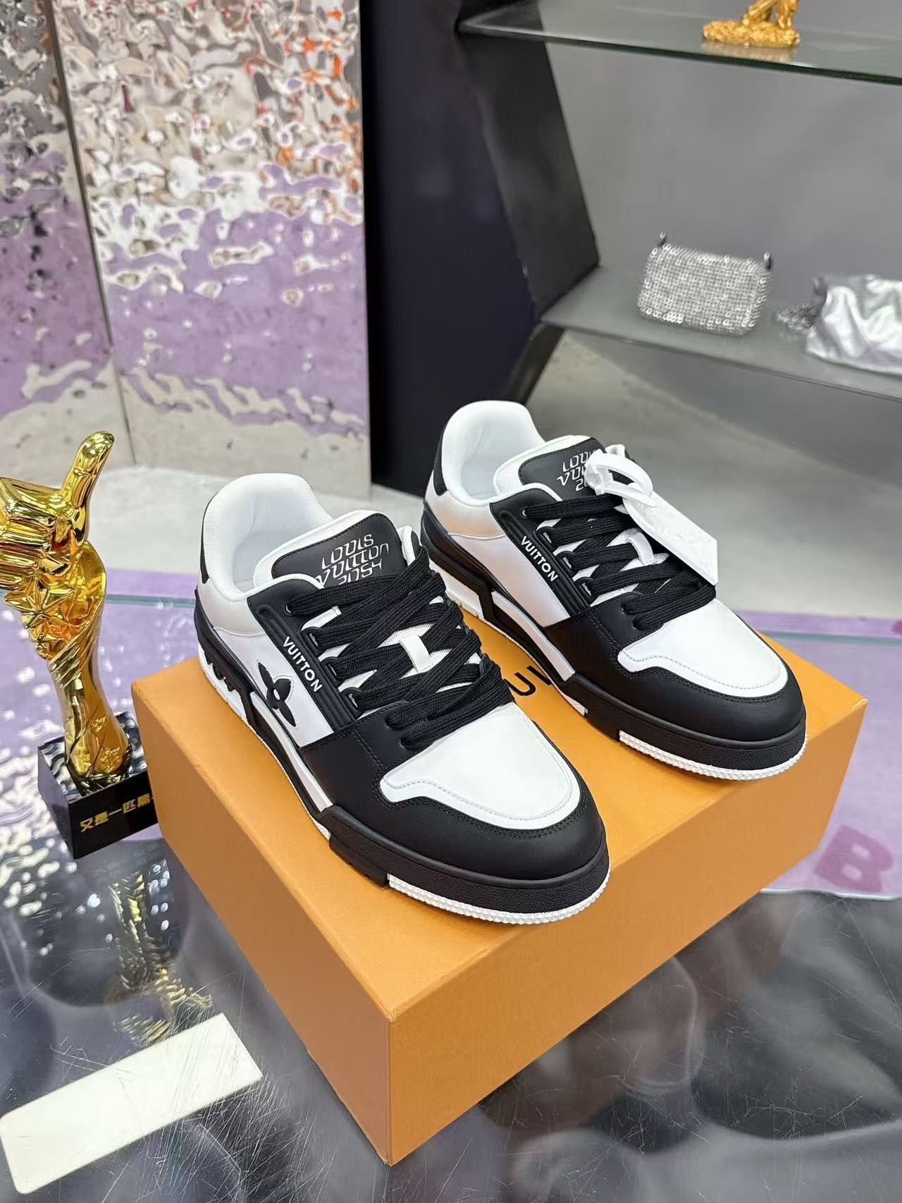 LV TRAINER SNEAKERS IN BLACK AND WHITE CALFSKIN