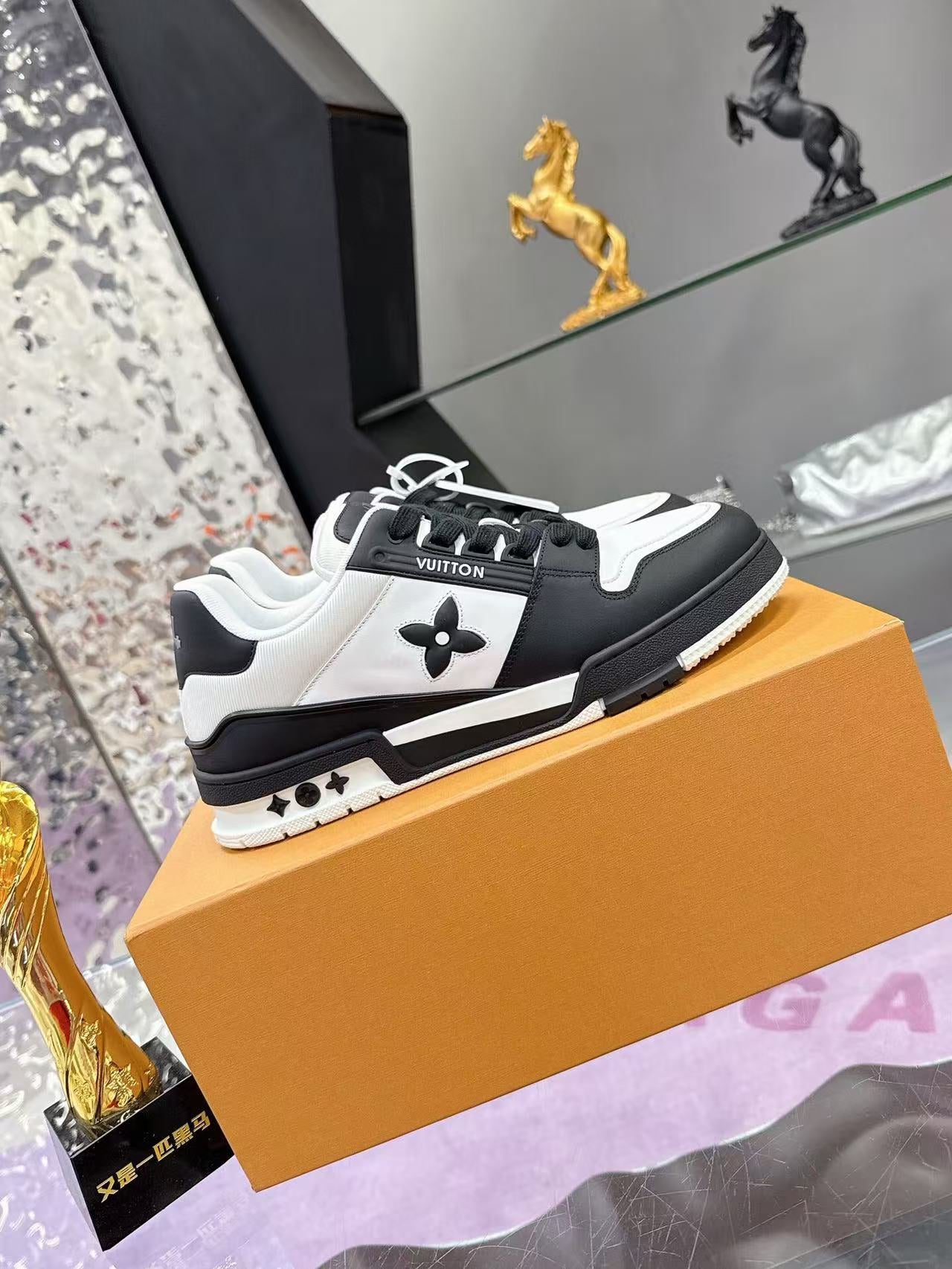 LV TRAINER SNEAKERS IN BLACK AND WHITE CALFSKIN