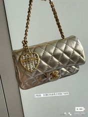 CC CLASSIC FLAP BAG 13 IN GOLD LAMBSKIN WITH PEARL HEART CHARM