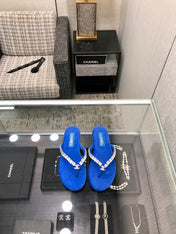 THONG SLIDE IN COBALT BLUE SUEDE WITH WHITE CRYSTALS