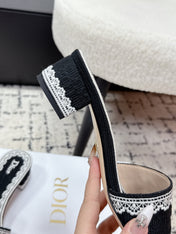DIOR 26S HIGH HEEL SLIDES IN BLACK AND WHITE EMBOSSED OBLIQUE LACE EMBROIDERY