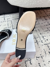 DIOR 26S HIGH HEEL SLIDES IN BLACK AND WHITE EMBOSSED OBLIQUE LACE EMBROIDERY