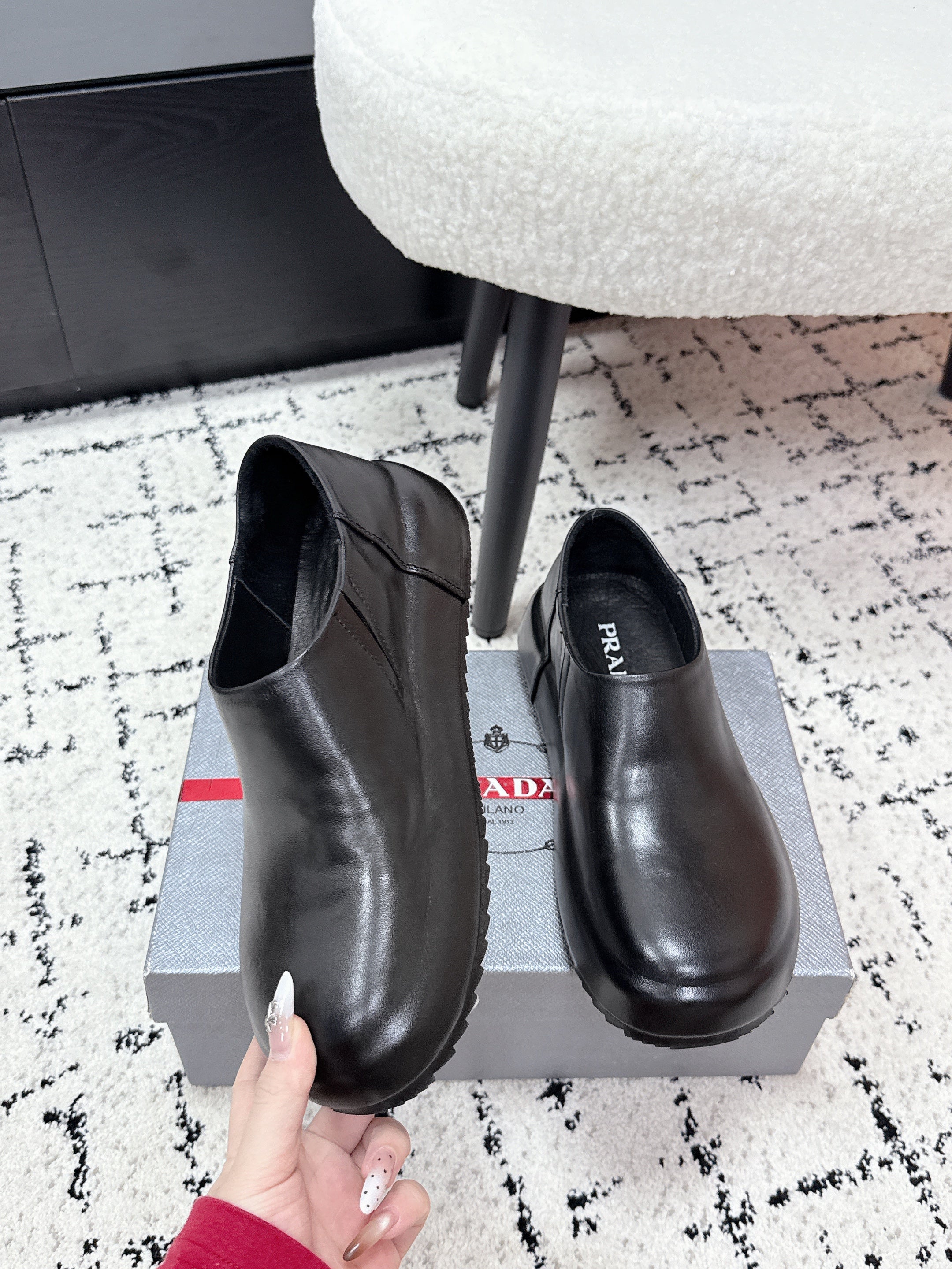 PRADA 26S SLIP ON SHOES IN BLACK SMOOTH CALFSKIN