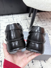 PRADA 26S SNEAKERS IN BLACK SHINY CALFSKIN