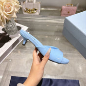 PRADA 26S LOGO EMBOSSED KITTEN HEEL MULES IN SKY BLUE PATENT CALFSKIN