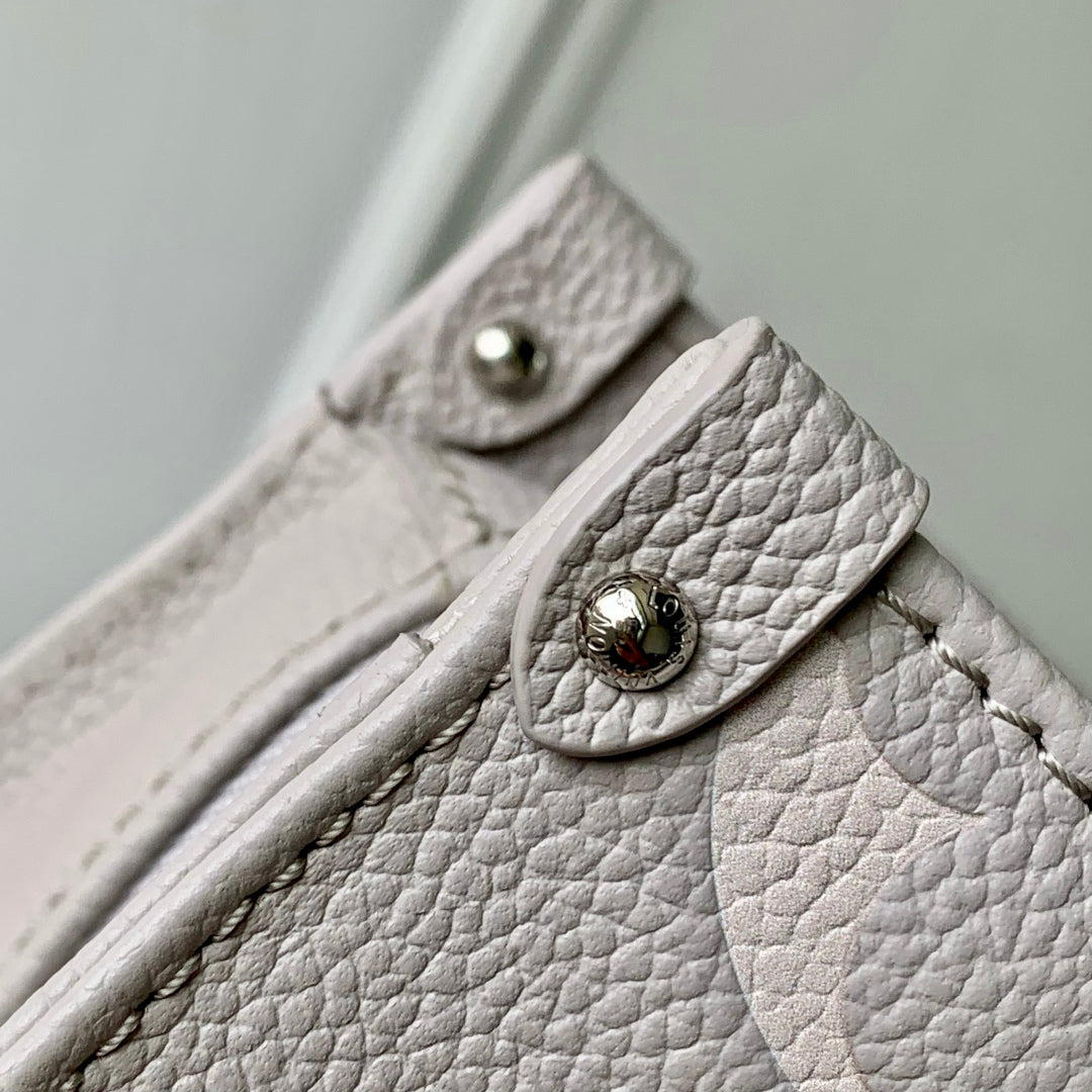 ONTHEGO EAST WEST BAG 25 IN BICOLOR MONOGRAM EMPREINTE LEATHER