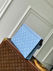 POCHETTE VOYAGE 26 IN LIGHT BLUE MONOGRAM ECLIPSE CALFSKIN