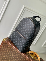 DISCOVERY SLIM BACKPACK 38 IN BLACK MONOGRAM ECLIPSE COATED CALFSKIN