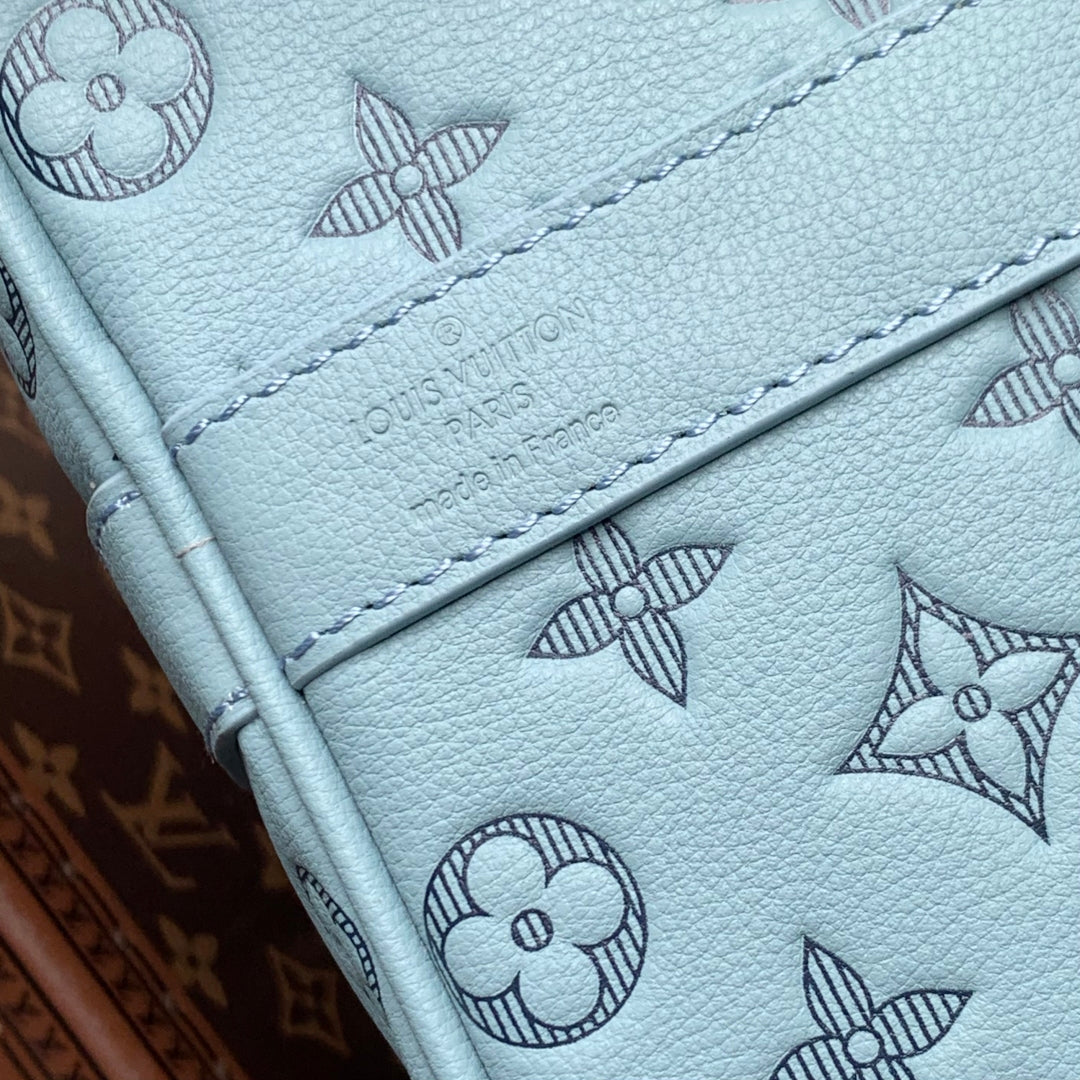 KEEPALL BANDOULIÈRE 50 IN SKY BLUE MONOGRAM SHADOW EMBOSSED CALFSKIN