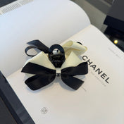 CHANEL 26S BOW HAIR CLIP IN BLACK AND WHITE SATIN 503131