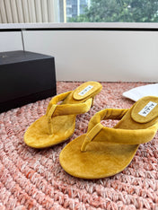ALAIA 26S HEELED THONG SANDALS IN MUSTARD YELLOW VELVET