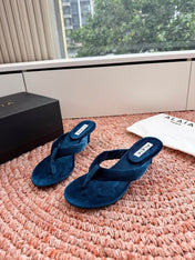 ALAIA 26S HEELED THONG SANDALS IN DARK BLUE VELVET