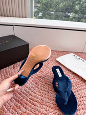 ALAIA 26S HEELED THONG SANDALS IN DARK BLUE VELVET