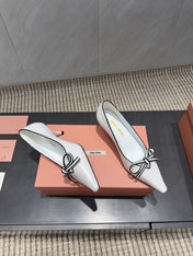 MIUMIU 26S POINTED TOE PUMPS 55MM IN WHITE AND BLACK CALFSKIN WITH BOW