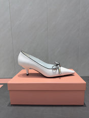 MIUMIU 26S POINTED TOE PUMPS 55MM IN WHITE AND BLACK CALFSKIN WITH BOW