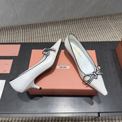 MIUMIU 26S POINTED TOE PUMPS 55MM IN WHITE AND BLACK CALFSKIN WITH BOW