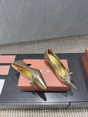 MIUMIU 26S POINTED TOE PUMPS 55MM IN GOLD CALFSKIN WITH BOW