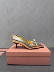 MIUMIU 26S POINTED TOE PUMPS 55MM IN GOLD CALFSKIN WITH BOW
