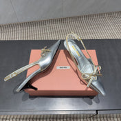 MIUMIU 26S SLINGBACK 55MM IN SILVER CALFSKIN WITH BOW