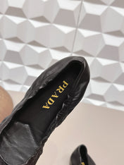 PRADA 26S ROUND TOE FLATS WITH BOW IN BLACK CALFSKIN