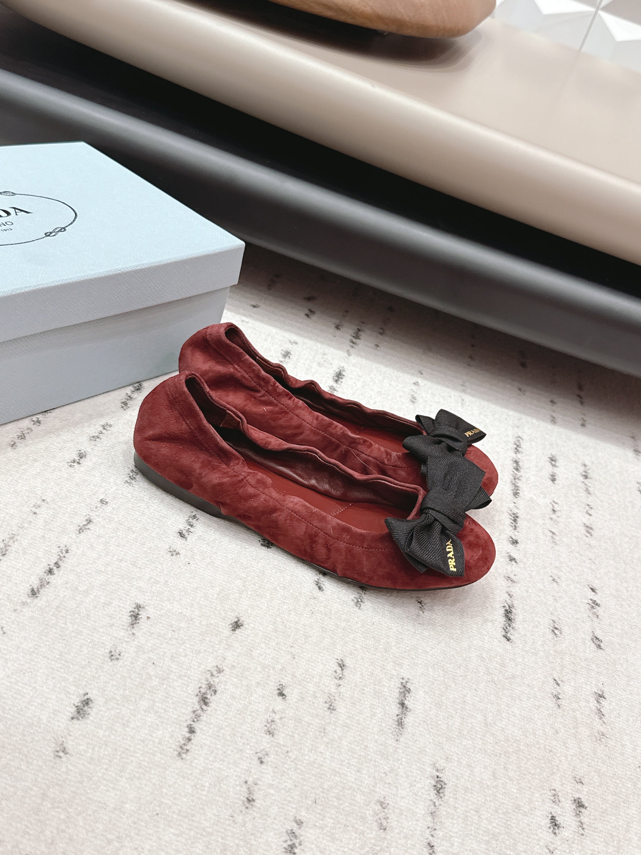 PRADA 26S ROUND TOE FLATS WITH BOW IN DARK RED SUEDE