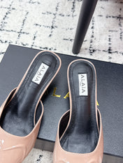 ALAIA 26S HEELED MULES 65 MM IN NUDE PINK GLOSSY CALFSKIN
