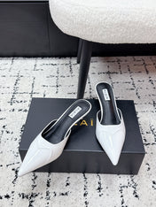 ALAIA 26S HEELED MULES 65 MM IN WHITE GLOSSY CALFSKIN