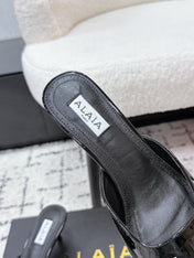 ALAIA 26S HEELED MULES 65 MM IN BLACK GLOSSY CALFSKIN