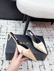 ALAIA 26S HEELED MULES 65 MM IN IVORY BEIGE SATIN