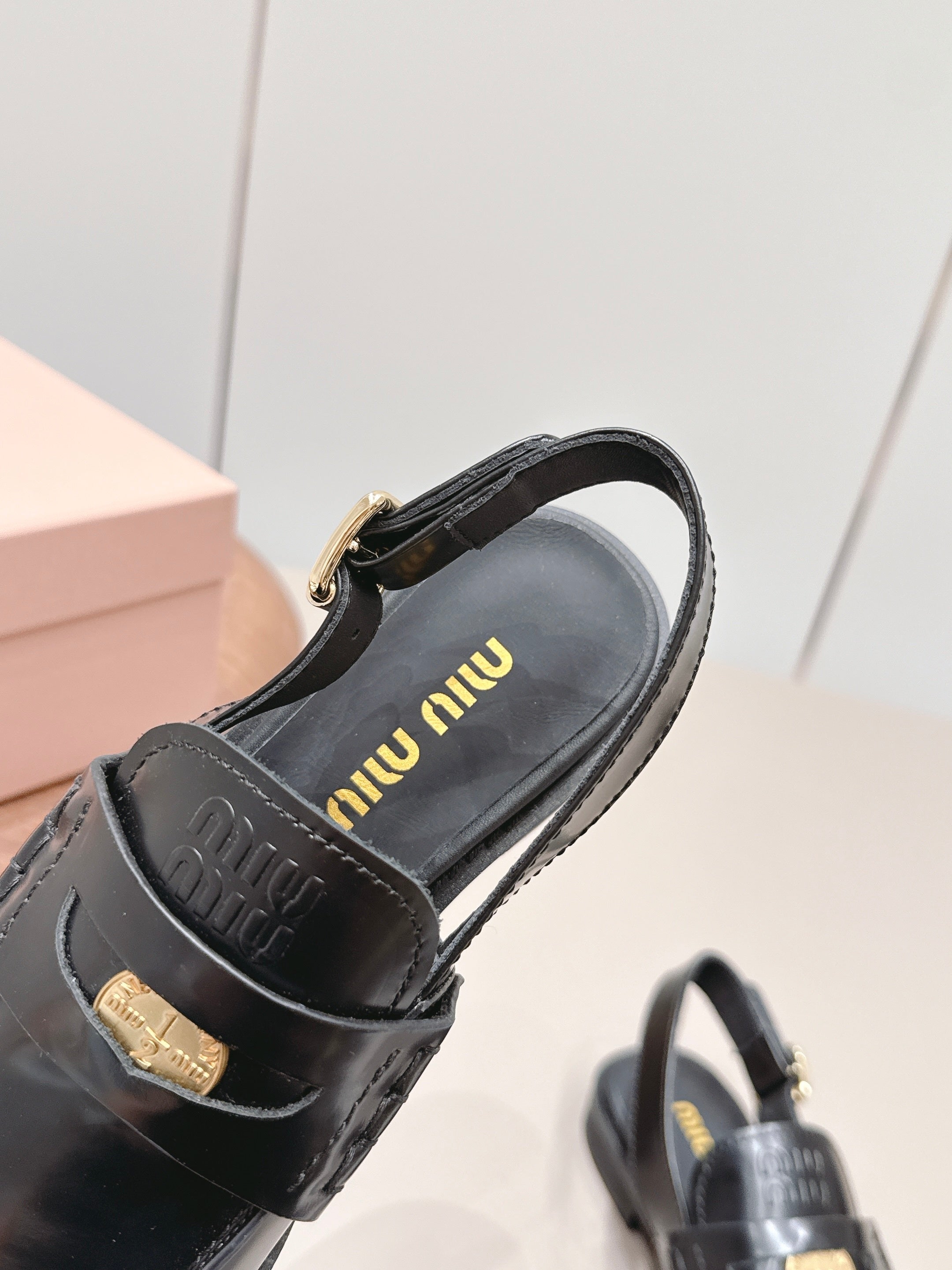 MIUMIU 26S PENNY SLINGBACK LOAFERS IN BLACK CALFSKIN GOLD HARDWARE