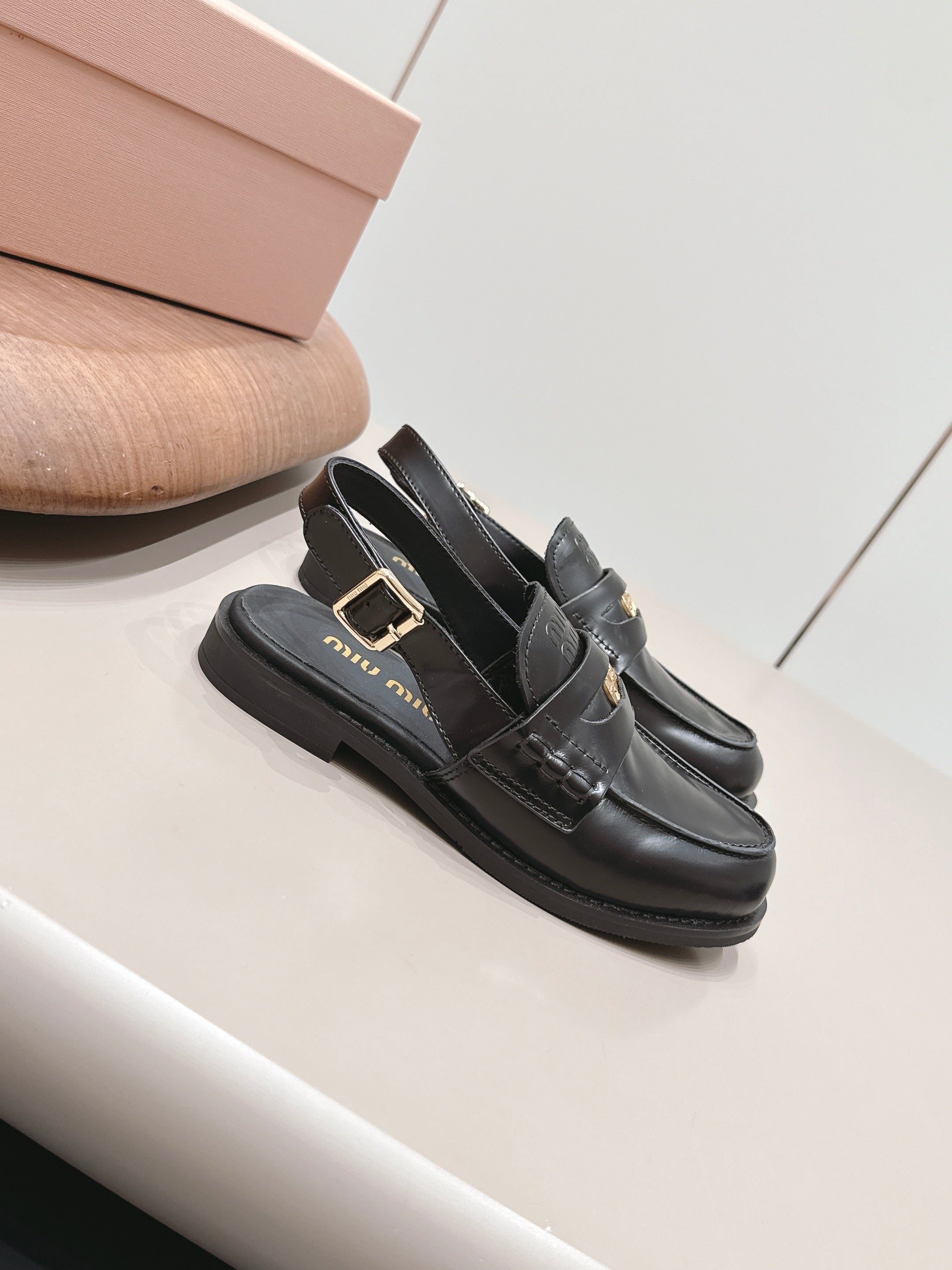 MIUMIU 26S PENNY SLINGBACK LOAFERS IN BLACK CALFSKIN GOLD HARDWARE